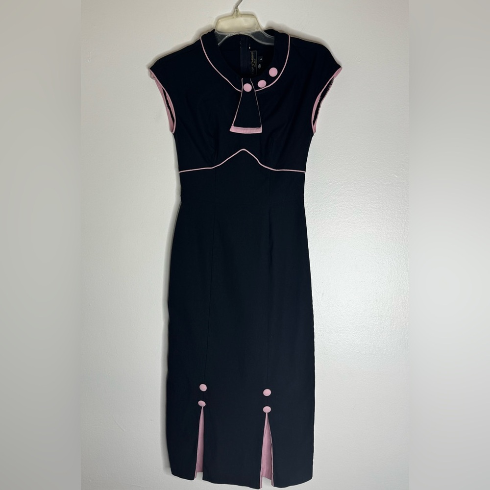 Stop Staring 50’s Black Midi Dress with Pink Accents. Pink peekaboo split